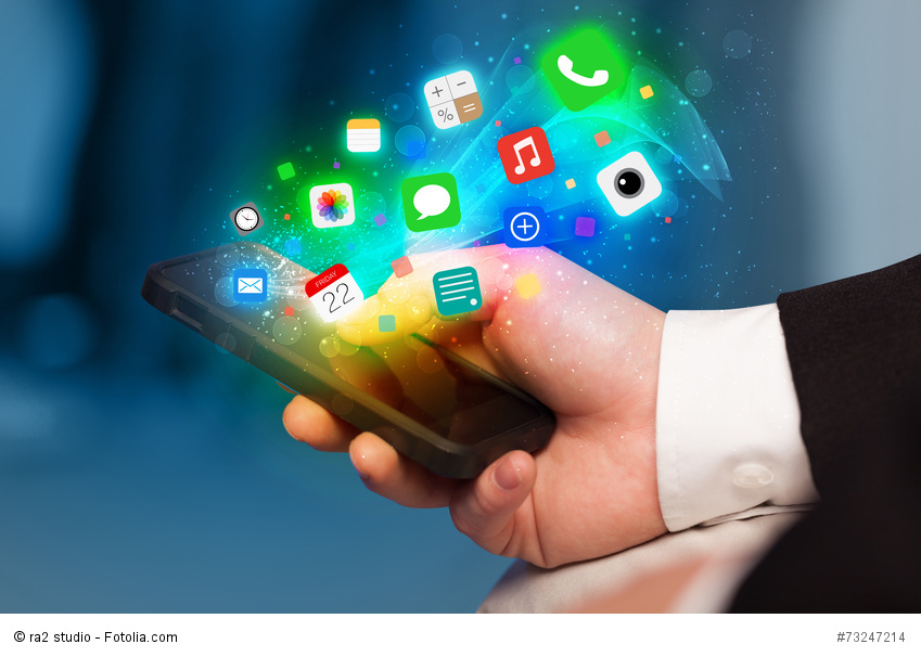 Hand holding smartphone with colorful app icons